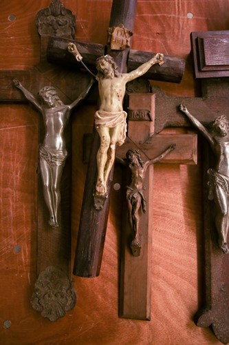 Lot 101 - A collection of large antique crucifixes,...