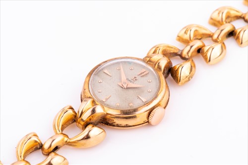 Lot 299 - A ladies yellow metal Omega wristwatch with...