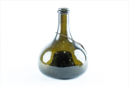 Lot 201 - An 18th century onion glass wine bottle with...