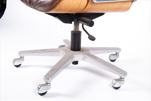 Lot 124 - A late 20th century Eames style swivel office...