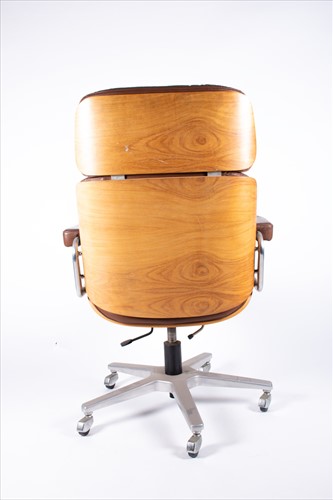 Lot 124 - A late 20th century Eames style swivel office...