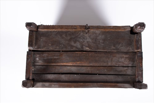 Lot 125 - An 18th century carved oak coffer of small...