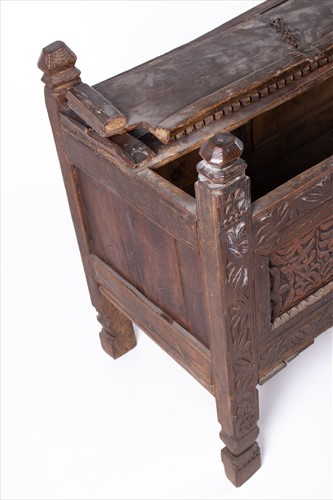 Lot 125 - An 18th century carved oak coffer of small...