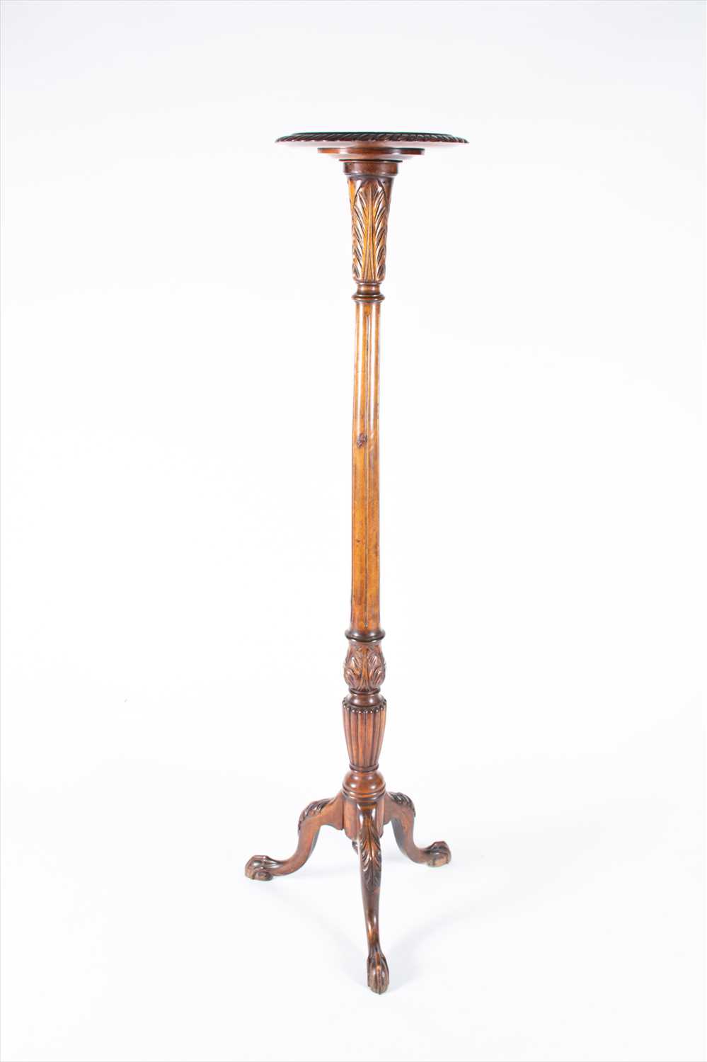 Lot 126 - A late Victorian mahogany torchere with reeded...