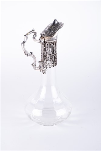 Lot 200 - An early 20th century claret jug with faceted...