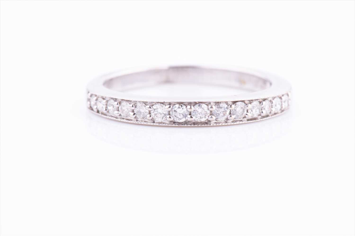 Lot 400 - An 18ct white gold and diamond half eternity...