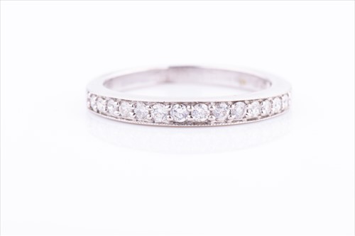 Lot 400 - An 18ct white gold and diamond half eternity...
