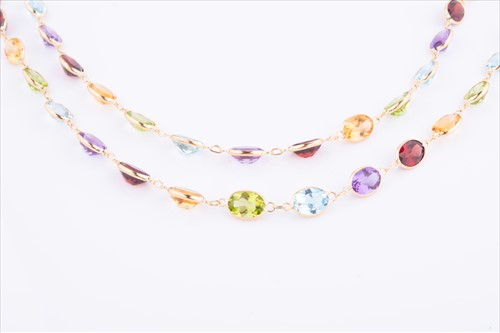 Lot 381 - An 18ct yellow gold and multi-gem necklace set...