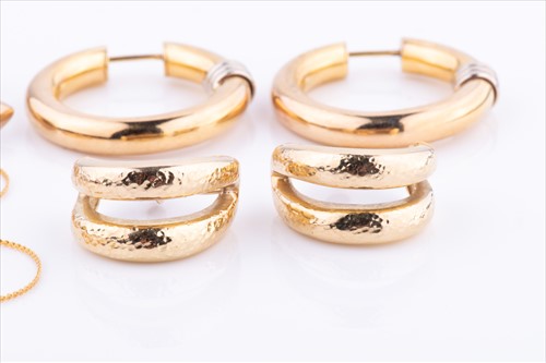 Lot 387 - A pair of 9ct yellow gold hoop earrings...