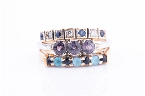 Lot 463 - A 9ct yellow gold, sapphire, and blue topaz...