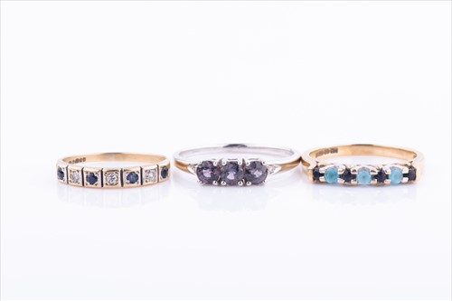 Lot 463 - A 9ct yellow gold, sapphire, and blue topaz...