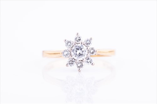Lot 349 - An 18ct yellow gold and diamond daisy cluster...