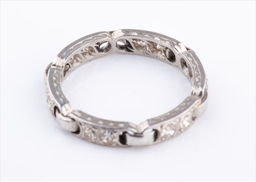Lot 356 - An unusual diamond eternity ring set with...