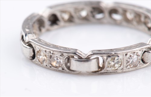 Lot 356 - An unusual diamond eternity ring set with...