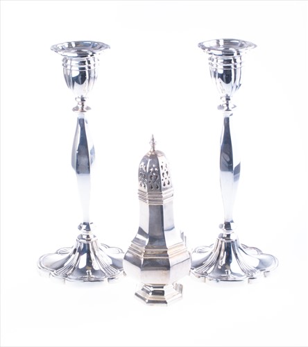 Lot 396 - A pair of George VI silver candlesticks...