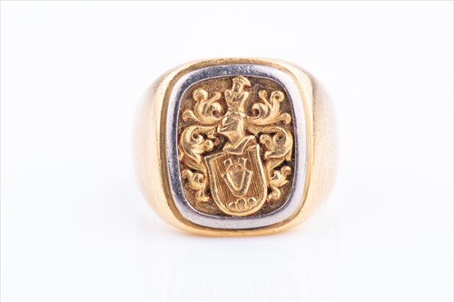 Lot 556 - A yellow and white metal gent's signet ring...