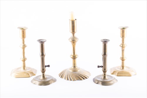 Lot 296 - A collection of Georgian brass candlesticks to...