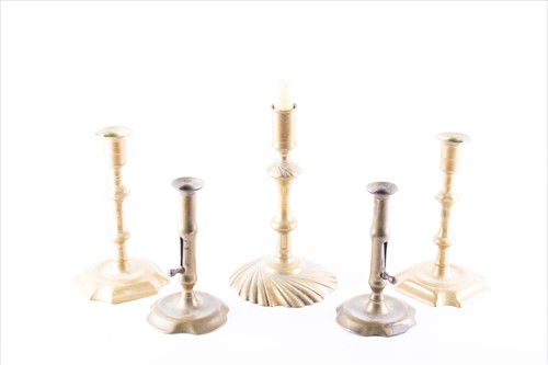 Lot 296 - A collection of Georgian brass candlesticks to...