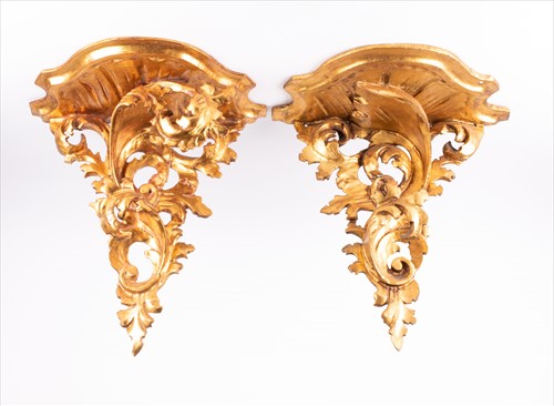 Lot 294 - A pair of gilt wall sconces with scroll...