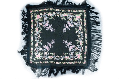 Lot 577 - A black silk manton de Manila shawl,...