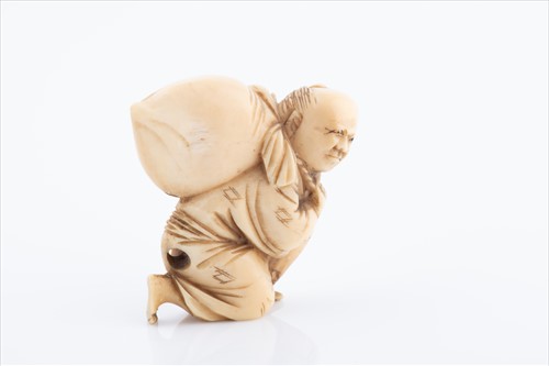 Lot 158 - A Japanese ivory netsuke in the form of a...