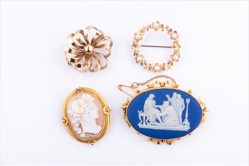 Lot 507 - A group of four yellow metal brooches to...