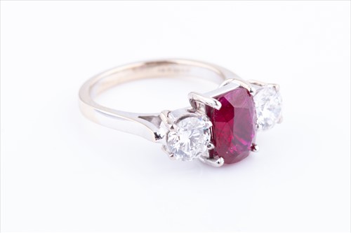 Lot 513 - An 18ct white gold, diamond, and ruby ring...