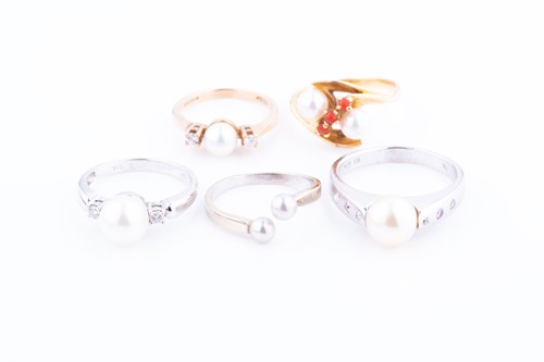 Lot 548 - Five cultured pearl rings one stamped 750 and...