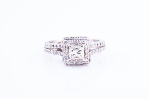 Lot 367 - A diamond cluster ring, centered with a...