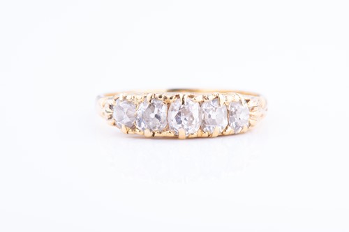 Lot 481 - A yellow metal and diamond ring set with five...