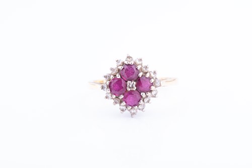 Lot 863 - A yellow metal, diamond and ruby cluster ring,...