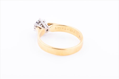Lot 420 - An 18ct yellow gold and solitaire diamond ring...