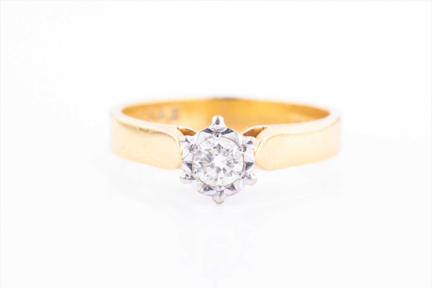 Lot 420 - An 18ct yellow gold and solitaire diamond ring...