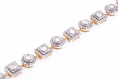 Lot 421 - An Indian diamond bracelet the alternating...