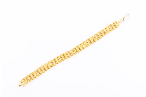 Lot 427 - A yellow metal fancy-link chain bracelet...