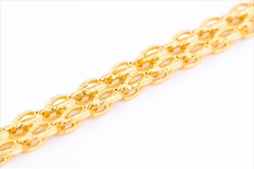 Lot 428 - A yellow metal fancy-link chain bracelet with...