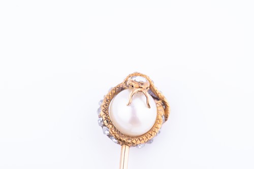 Lot 433 - Tiffany & Co. A diamond and pearl stick pin in...
