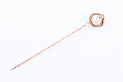 Lot 433 - Tiffany & Co. A diamond and pearl stick pin in...