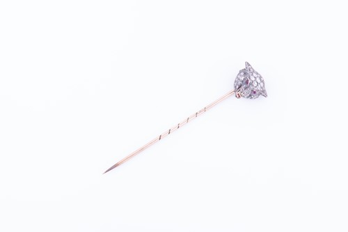 Lot 437 - A diamond-set stick pin in the form of a...