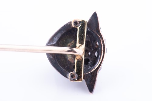 Lot 437 - A diamond-set stick pin in the form of a...