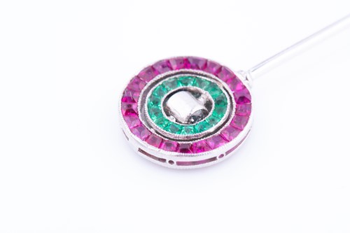 Lot 439 - A diamond, emerald, ruby, and sapphire stick...