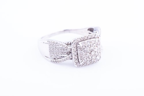 Lot 455 - A diamond cocktail ring set with a square...