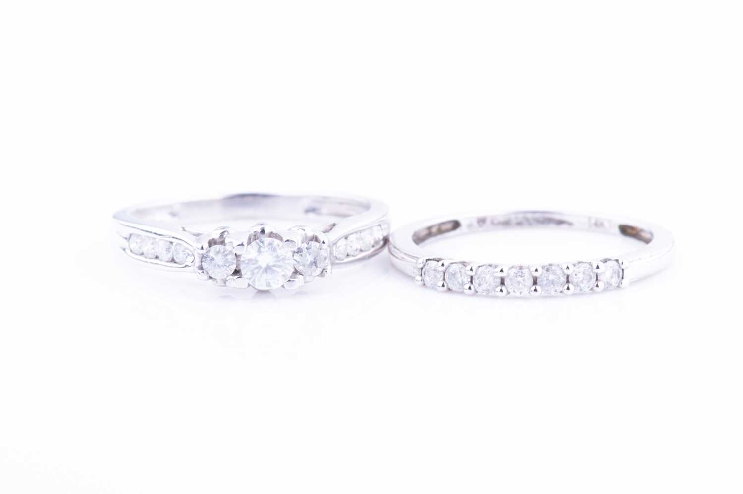 Lot 458 - A white metal and diamond ring set with three...