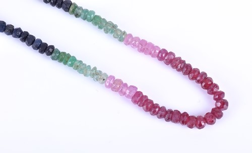 Lot 410 - A multi-coloured gemstone necklace, formed of...