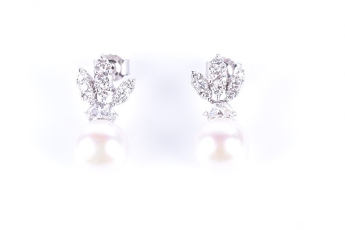 Lot 7 - A pair of diamond and pearl earrings the...