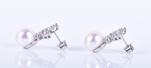 Lot 7 - A pair of diamond and pearl earrings the...