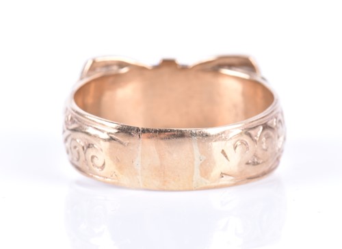 Lot 24 - A gentleman's 9ct yellow gold ring in the form...