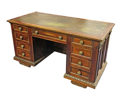 Lot 524 - A mahogany pedestal desk, the green leather...
