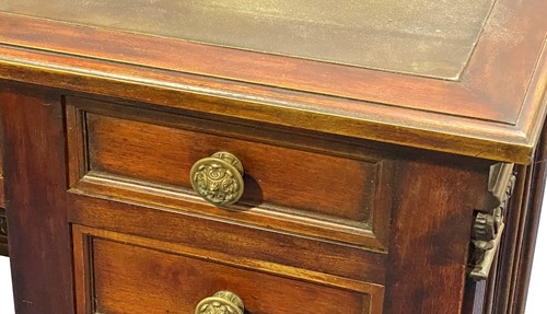 Lot 524 - A mahogany pedestal desk, the green leather...