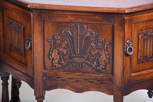 Lot 516 - An Old Charm oak side cabinet, the front...